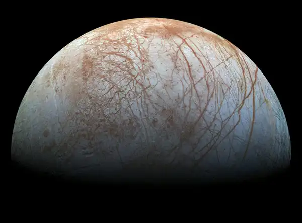 The puzzling, fascinating surface of Jupiter's icy moon Europa looms large in this newly-reprocessed color view, made from images taken by NASA's Galileo spacecraft in the late 1990s. NASA/JPL-Caltech/SETI Institute.